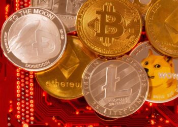 Representations of cryptocurrencies Bitcoin, Ethereum, DogeCoin, Ripple, Litecoin are placed on PC motherboard in this illustration taken – Colorado Springs Gazette