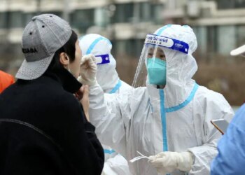 China Locks Down City Of 9 Million As Virus Ripples Across Country