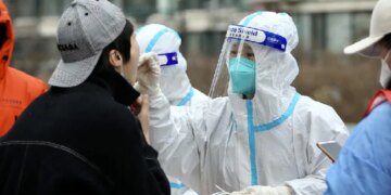 China Locks Down City Of 9 Million As Virus Ripples Across Country