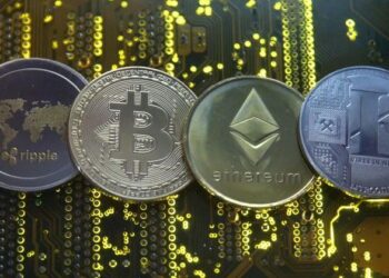 FILE PHOTO: Representations of the Ripple, Bitcoin, Etherum and Litecoin virtual currencies are seen on motherboard in this illustration picture – Colorado Springs Gazette