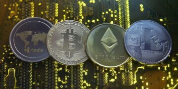FILE PHOTO: Representations of the Ripple, Bitcoin, Etherum and Litecoin virtual currencies are seen on motherboard in this illustration picture – Colorado Springs Gazette